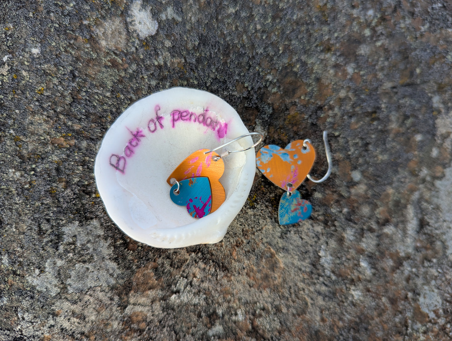 Orange and blue heart shaped dangle earrings